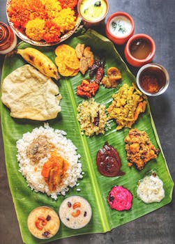 A vibrant display of Kerala Sadya on banana leaf, featuring traditional Onam dishes.